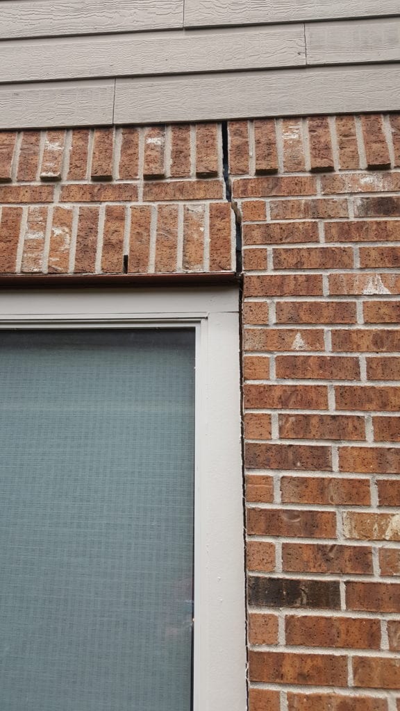 Exterior Warning Sign: Cracking Bricks